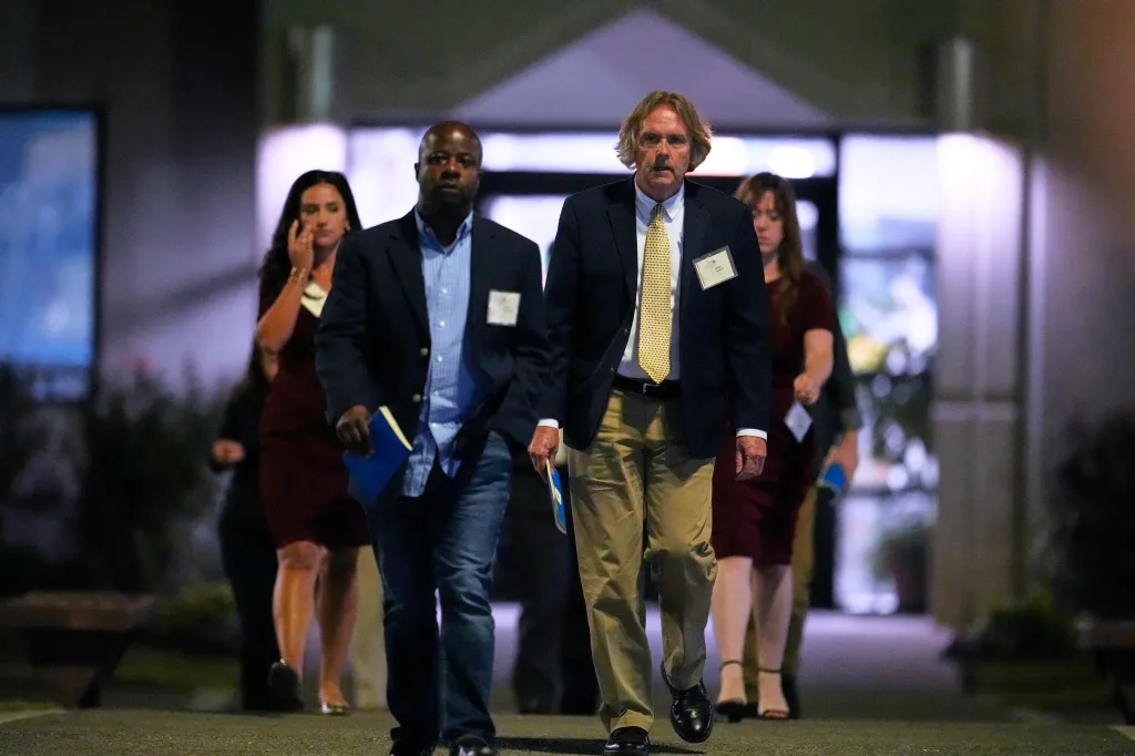 Media witnesses leave Riverbend Maximum Security Institution after an execution was halted.
