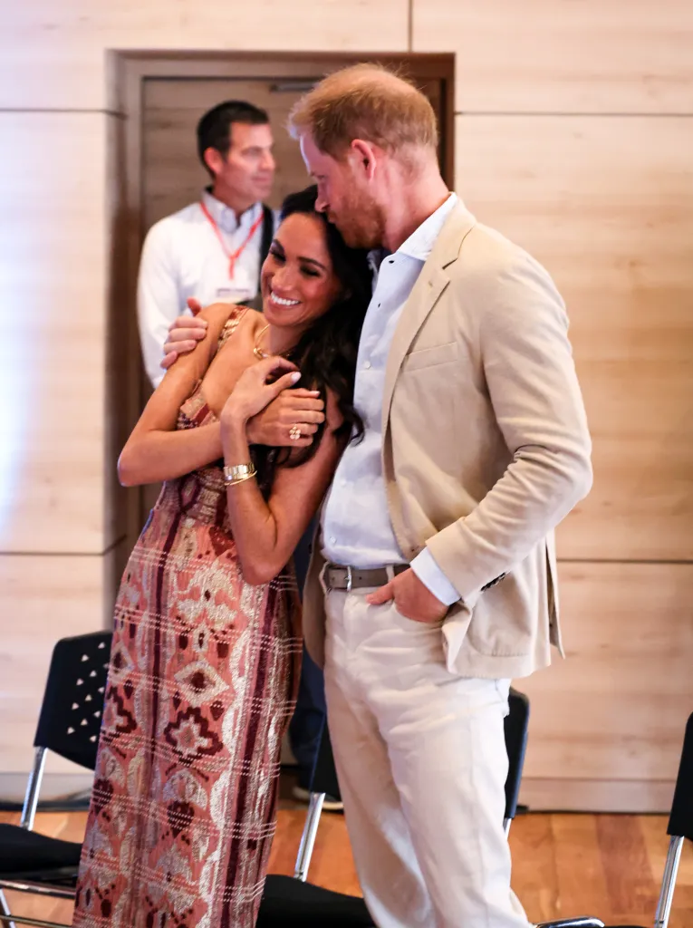 Meghan, Duchess of Sussex and Prince Harry, Duke of Sussex embrace and smile at Centro Nacional de las Artes Delia Zapata.