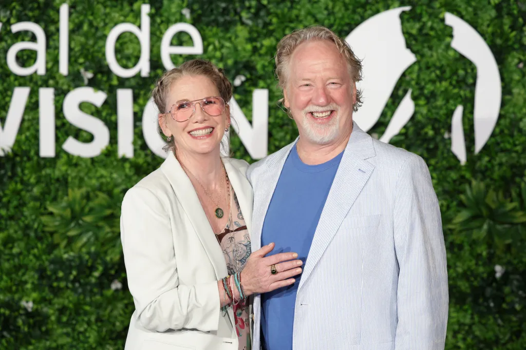 Melissa Gilbert and Timothy Busfield smiling together at a photocall.