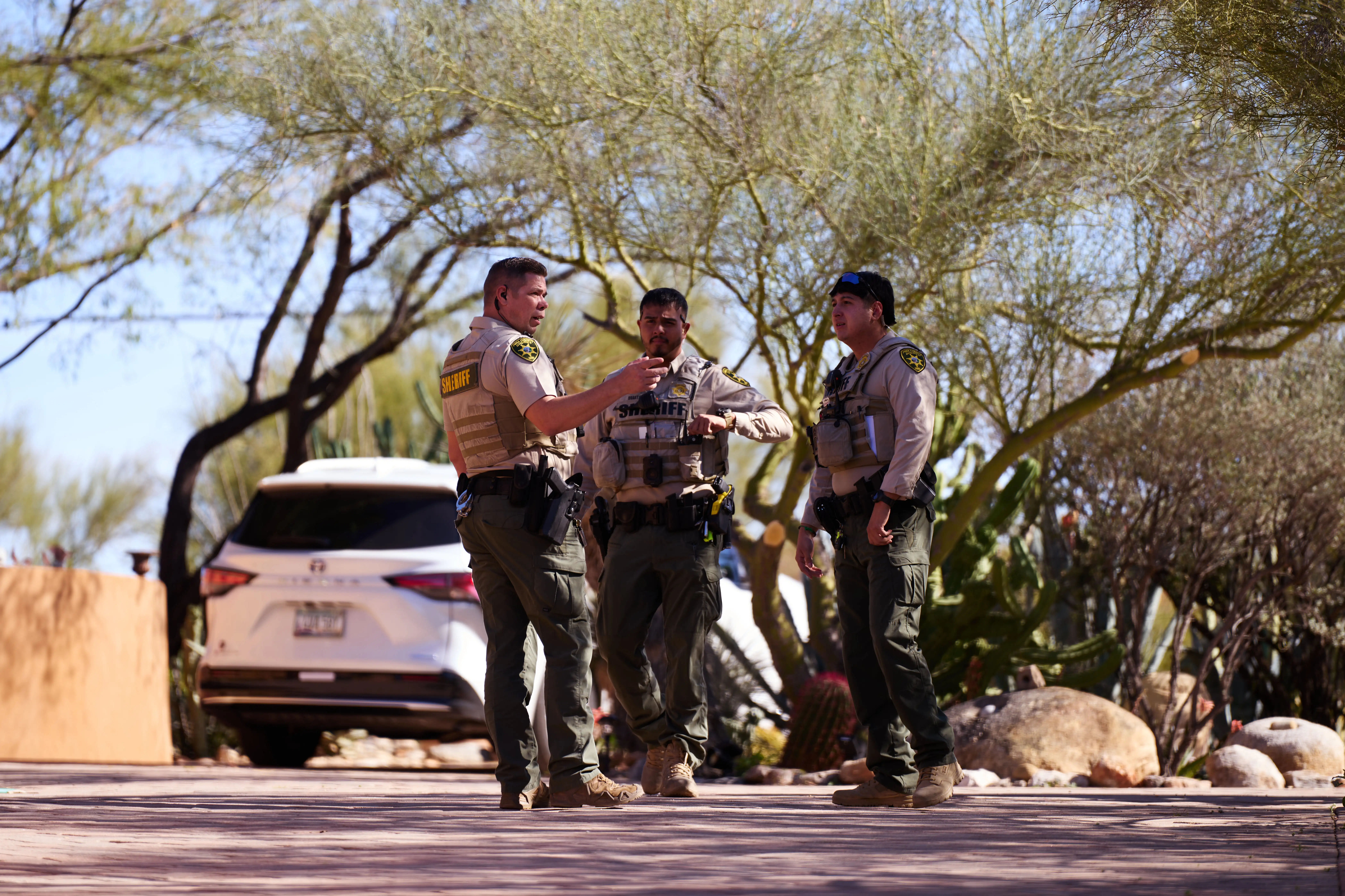 Members of the Pima County Sheriff’s Department investigate a possible trespass incident during the search for Nancy Guthrie.