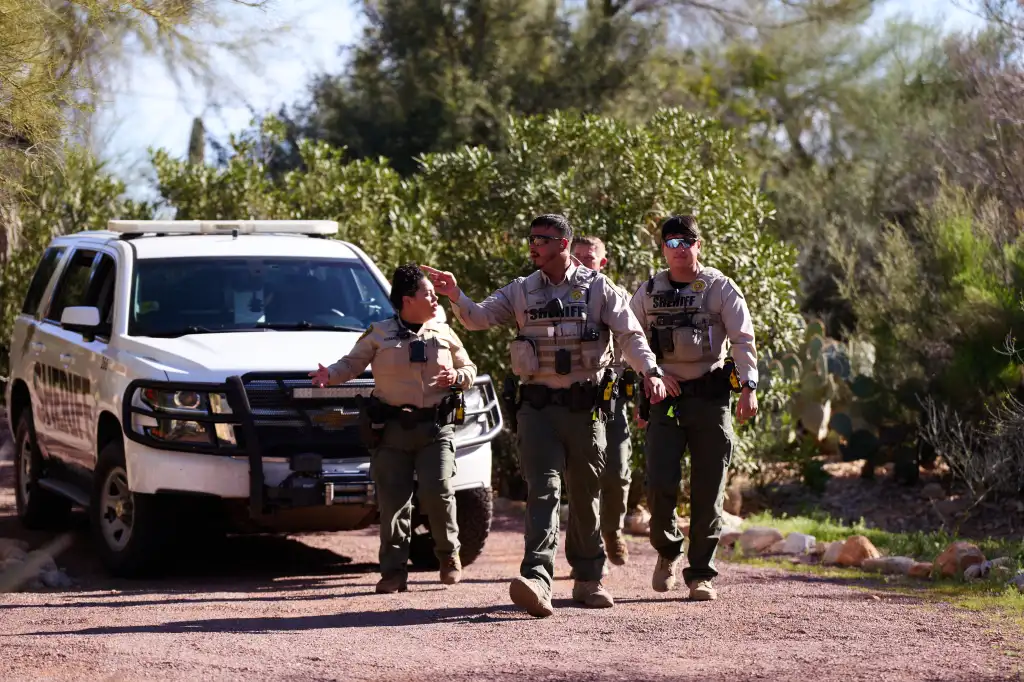 Members of the Pima County Sheriff's Department investigate a possible trespass incident in Tucson, Ariz., Feb. 22, 2026.