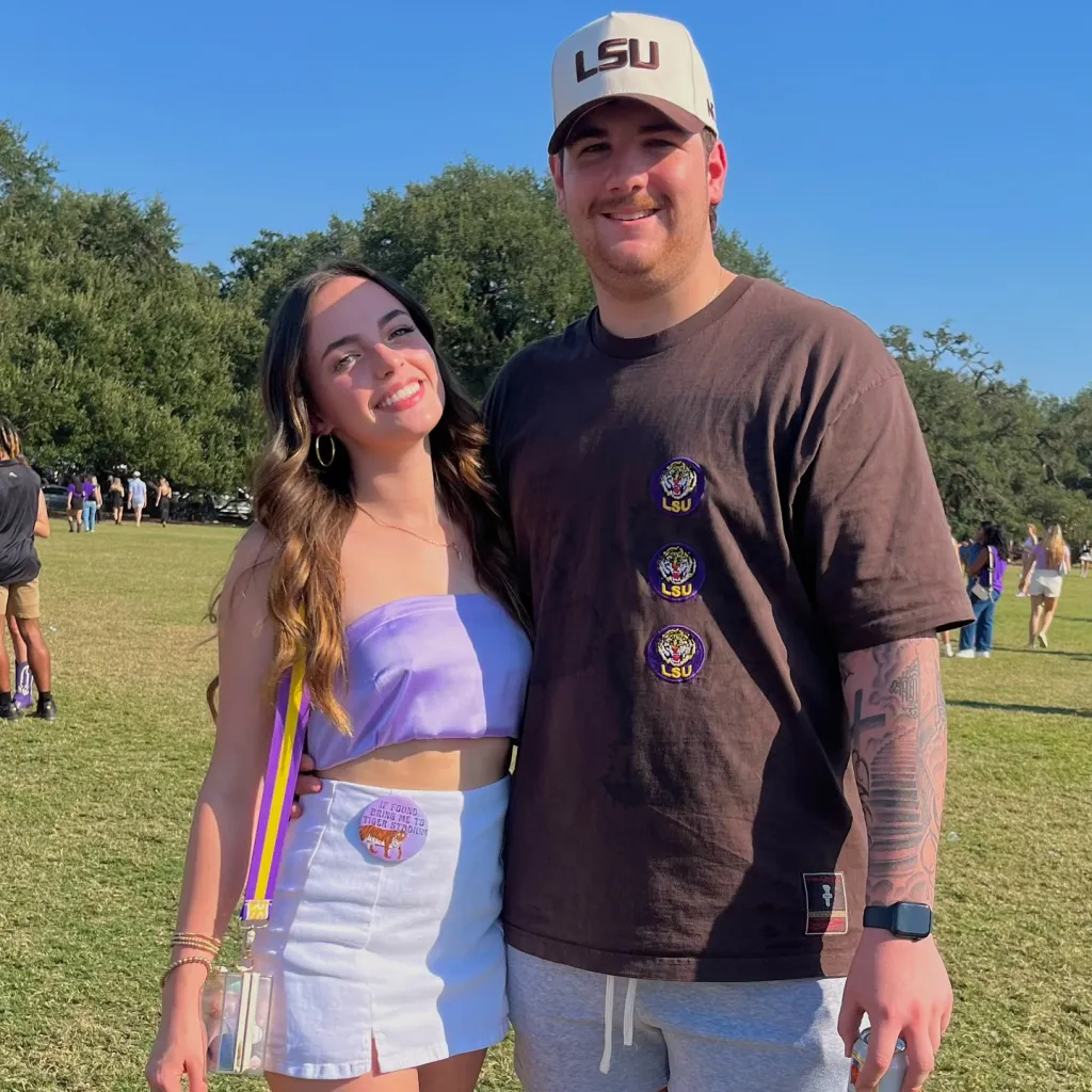 Leah Fonte and Shane Hirstius posing outdoors on a sunny day.