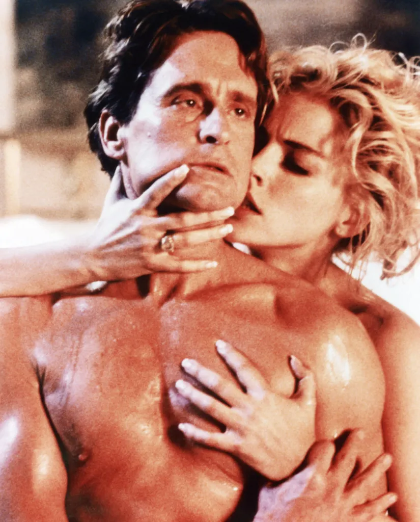 Sharon Stone caressing and kissing Michael Douglas in a scene from the film Basic Instinct.
