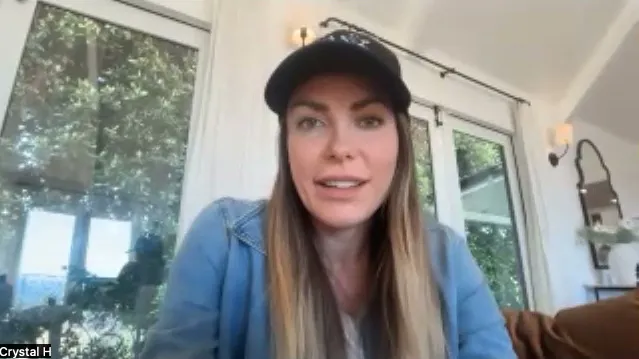 Crystal Hefner wearing a black cap and denim jacket.