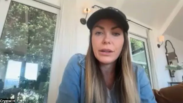 Crystal Hefner in a video call, wearing a black cap and a denim shirt.