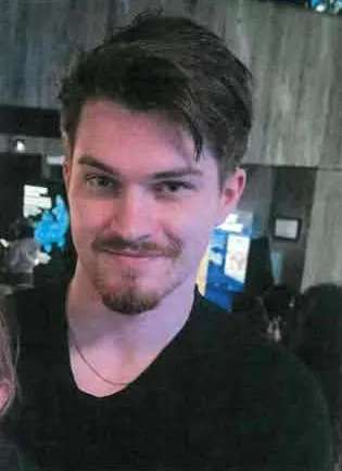 Photo of J.A. Schermerhorn wearing a black shirt with a mustache and a goatee.