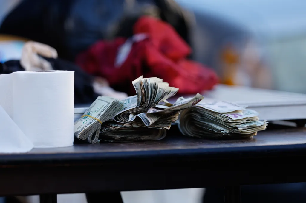 Confiscated money from drug dealers displayed on a table during