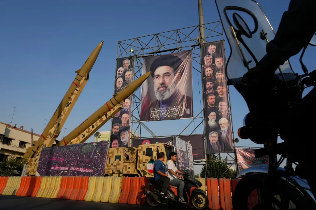 An Iranian missiles and banners showing portraits of Iranian Supreme Leader Ayatollah Mojtaba Khamenei, center, and late armed forces commanders and nuclear scientists, who were killed in Israeli and US strikes, displayed in a military exhibition at Baharestan Square in Tehran, on Sept. 28, 2026.