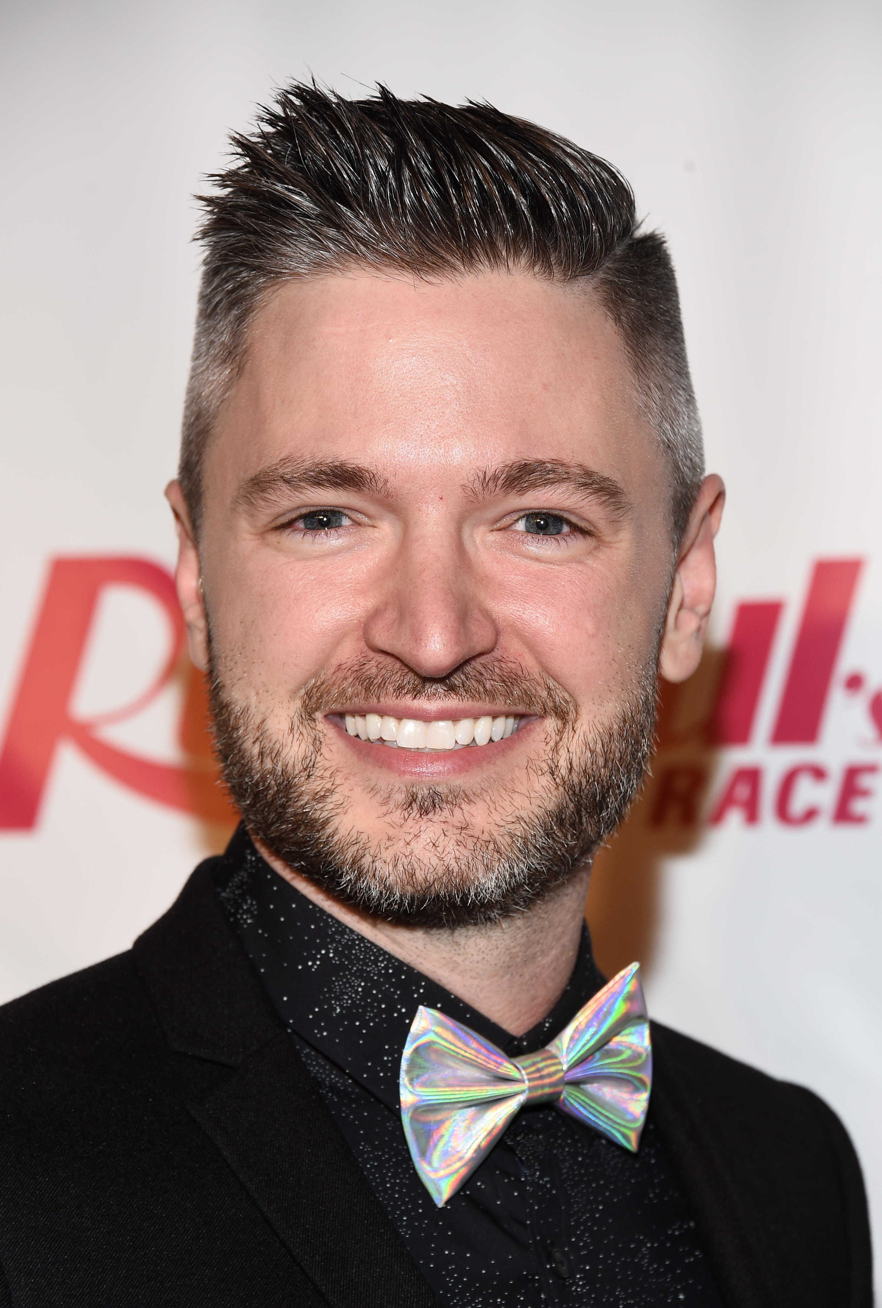 Music producer Lucian Piane smiles at the premiere of 