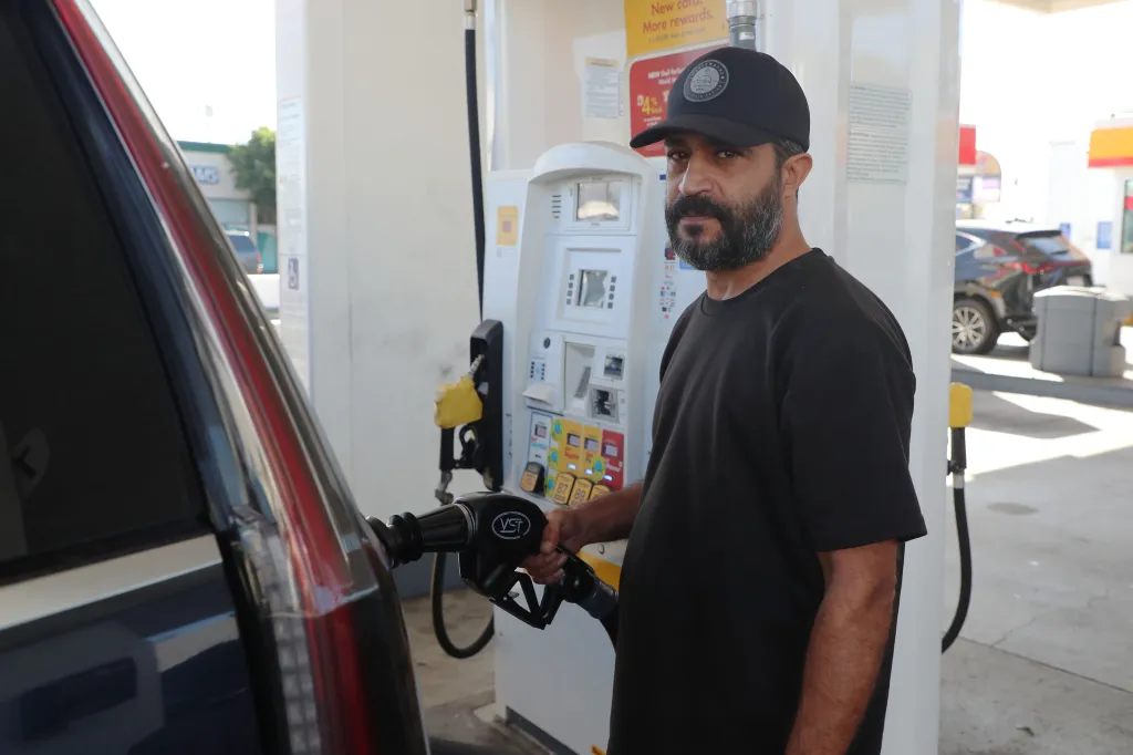Nader Jahanshir pumps gas at a Shell gas station.