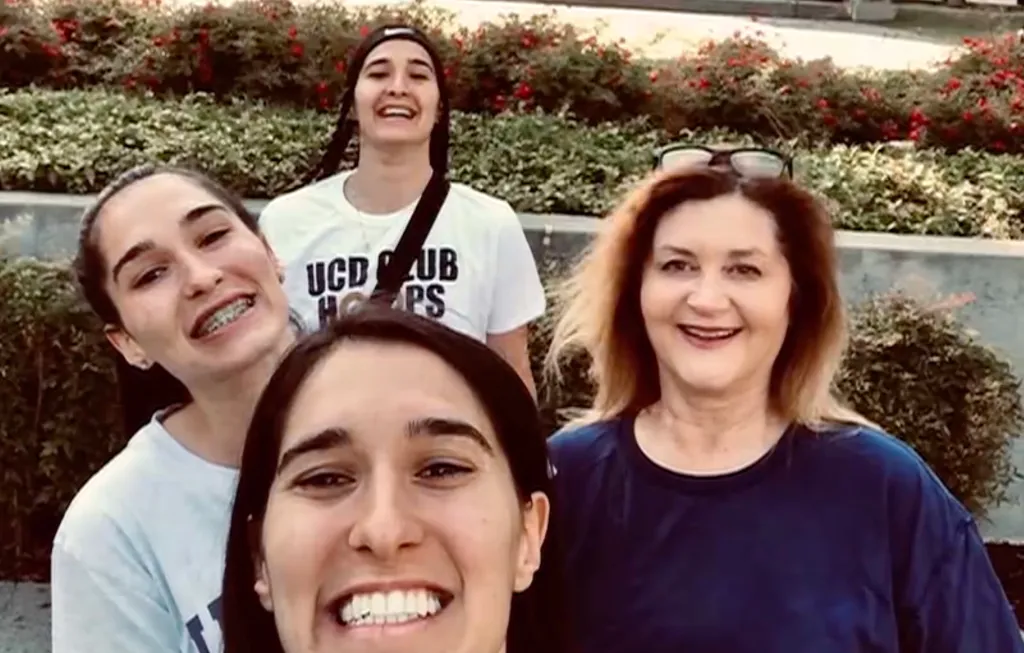 Nadine Jett poses with her foster daughters, the Lucci sisters.