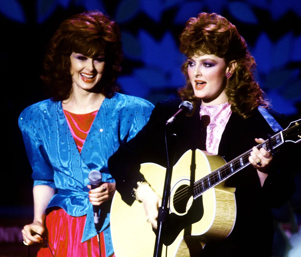 Naomi and Wynonna Judd of The Judds performing on stage.