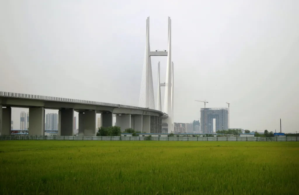 China and North Korea will open the 1.8-mile New Yalu River Bridge after a 10-year delay, boosting trade between Dandong and Sinuiju.