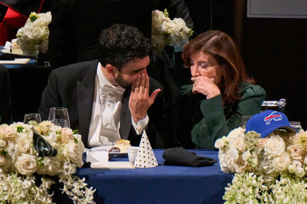 New York City Mayor Zohran Mamdani and New York Governor Kathy Hochul sit together at a table.