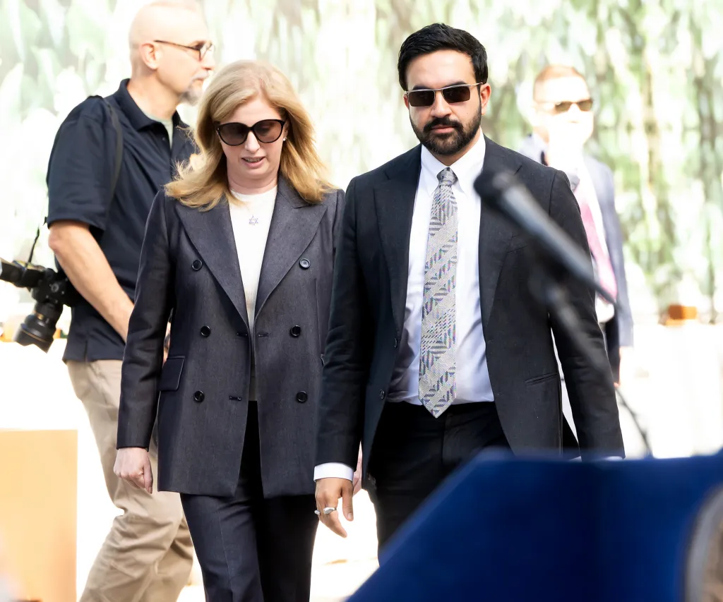 New York City Police Commissioner Jessica Tisch and New York City Mayor Zohran Mamdani walking outdoors.