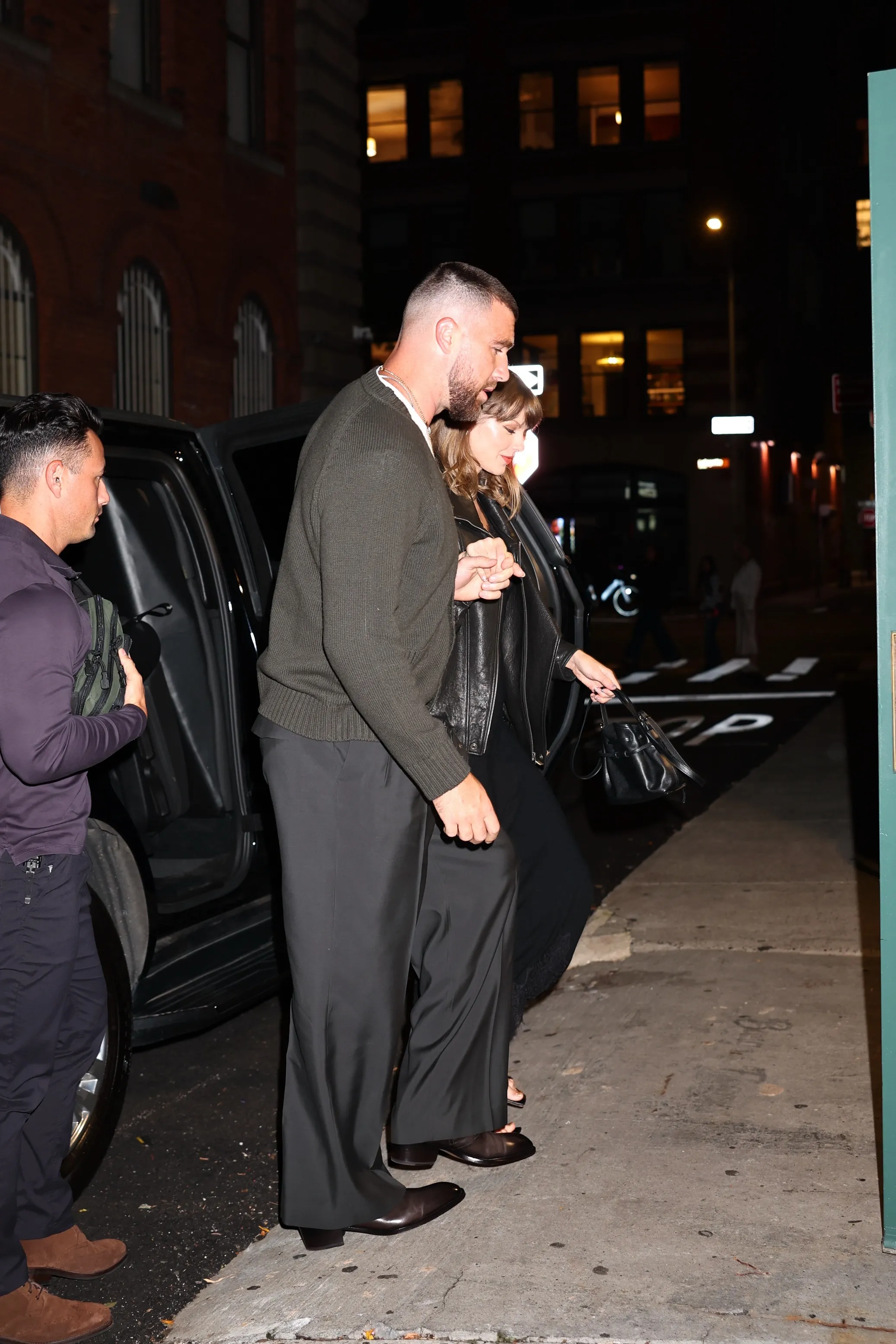 Taylor Swift and Travis Kelce arrive hand in hand for a dinner date in New York.