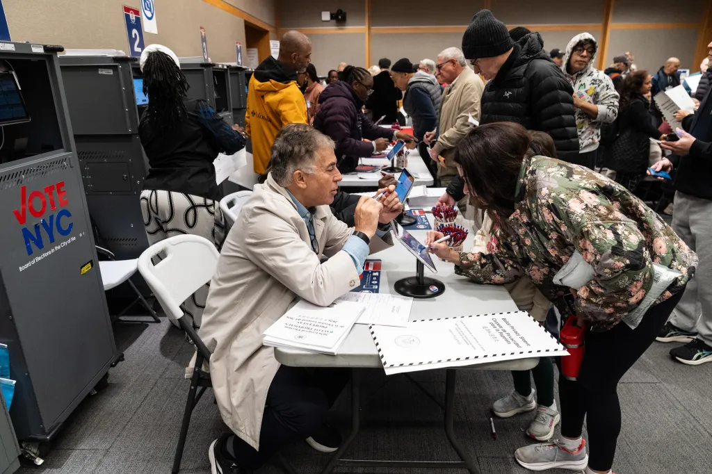 New Yorkers casting votes at a polling station.