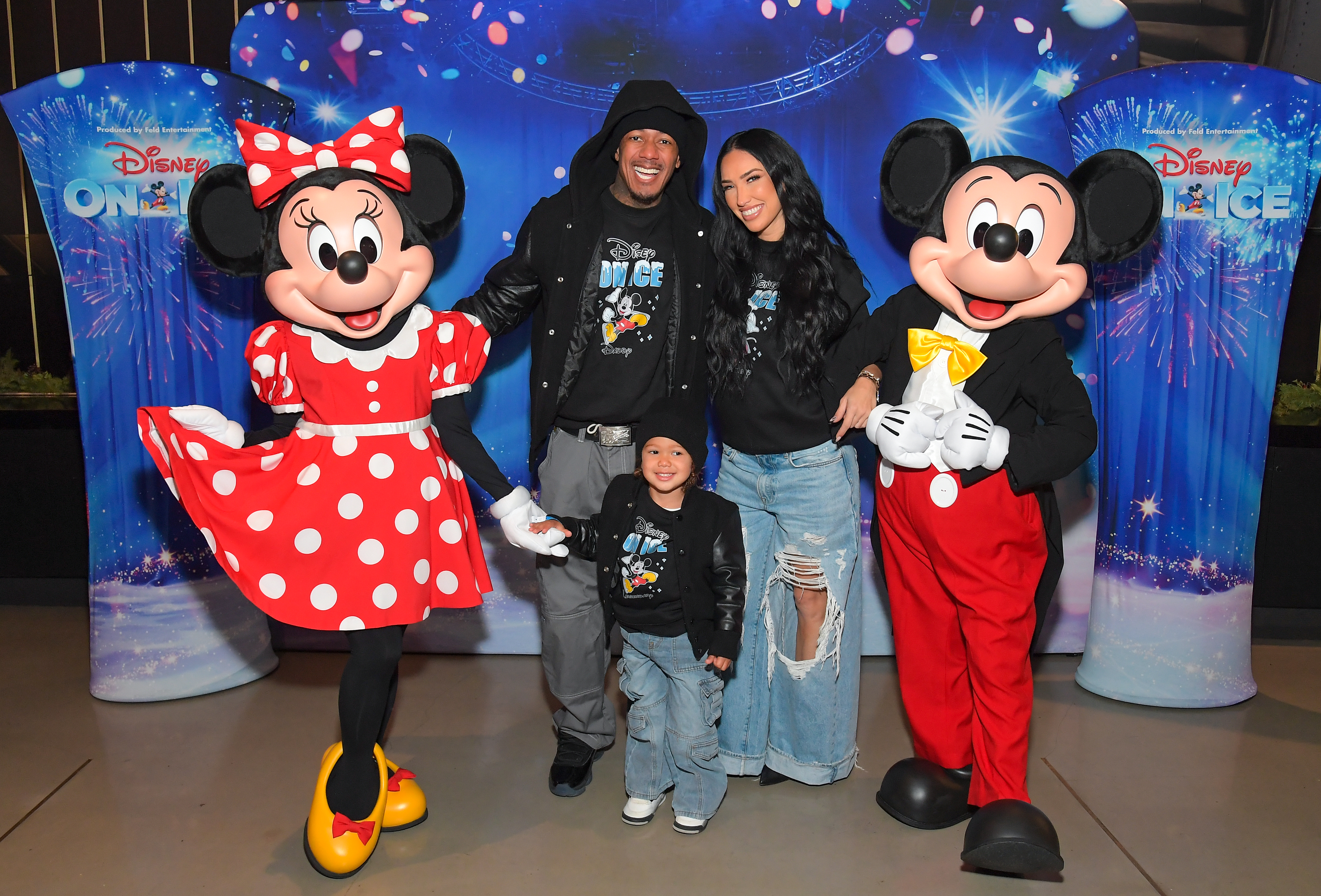 Nick Cannon, Legendary Love Cannon, and Bre Tiesi pose with Minnie Mouse and Mickey Mouse at Disney On Ice.