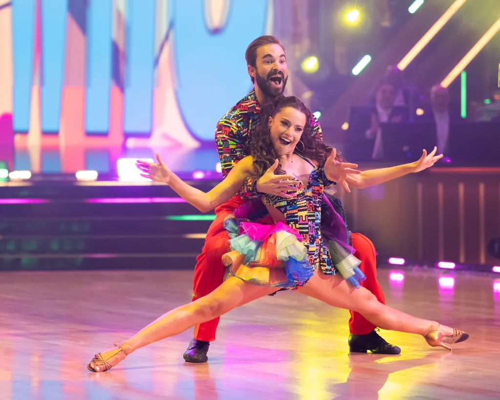 Conner Leavitt and Adele Zaikman perform on the ballroom floor.