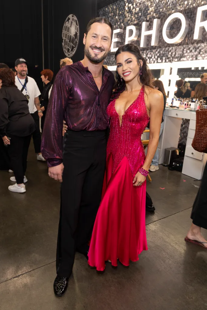 Valentin Chmerkovskiy and Jenna Dewan pose together in dance costumes.