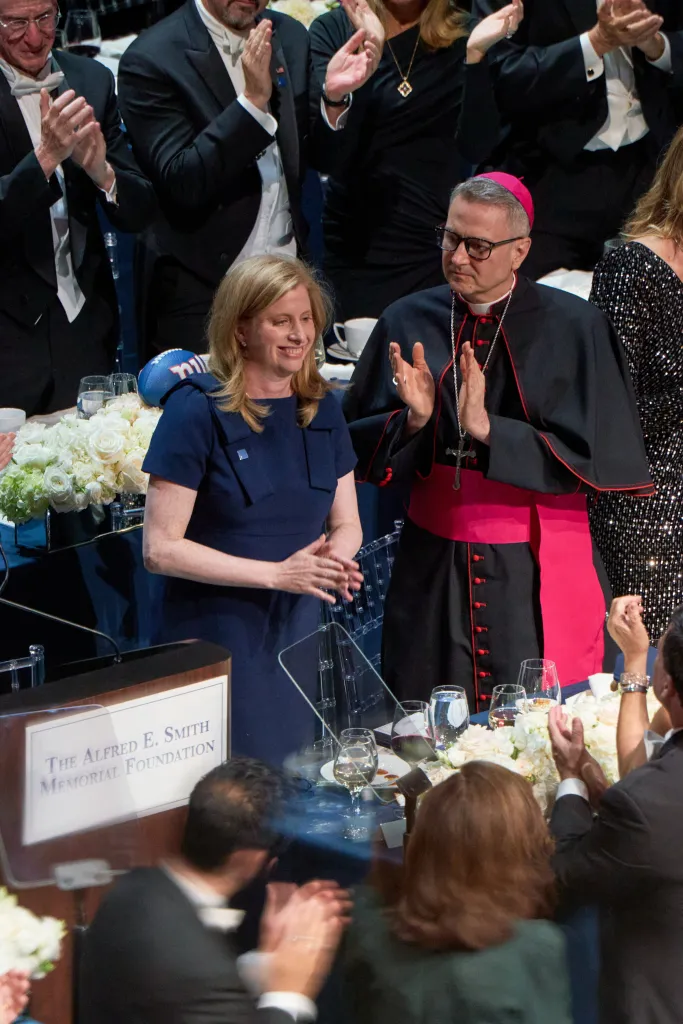 NYPD Commissioner Jessica Tisch and Reverend Ronald Hicks, Archbishop of New York, applaud at the Alfred E. Smith Memorial Foundation dinner.