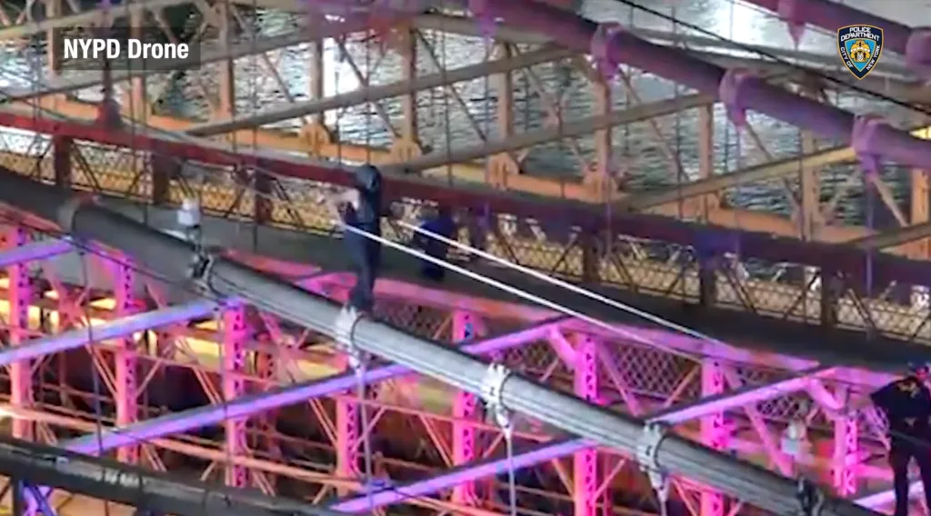 NYPD drone footage captures police shooting a knife-wielding man on the Brooklyn Bridge.