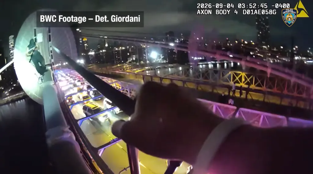 Bodycam footage showing a police officer aiming a weapon at a knife-wielding man on the Brooklyn Bridge.
