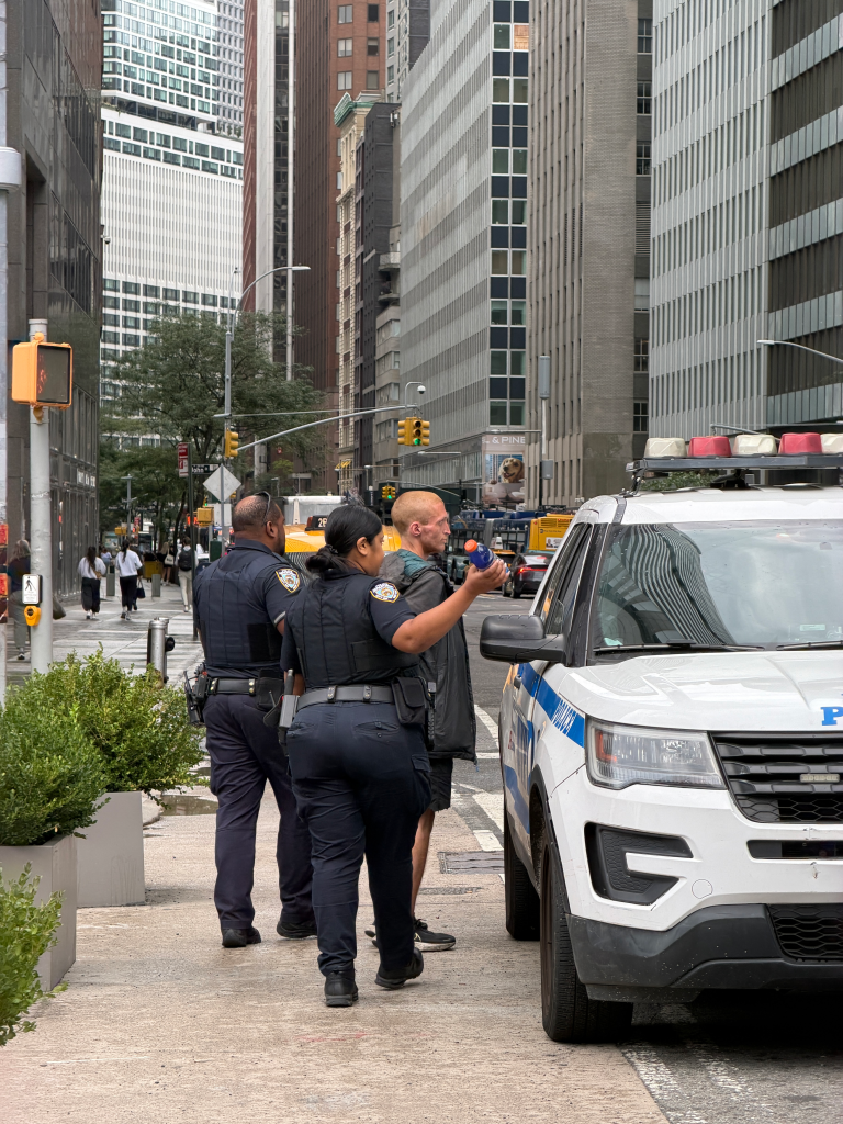 NYPD officers arrest Christopher Tarrant, 24.