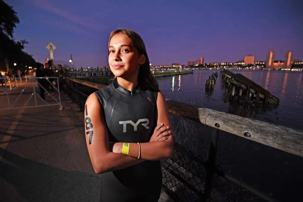 Illiana Blades, 14, of Brooklyn, prepares at the start line for the swim portion in the Hudson River as the NYC Triathlon returns.