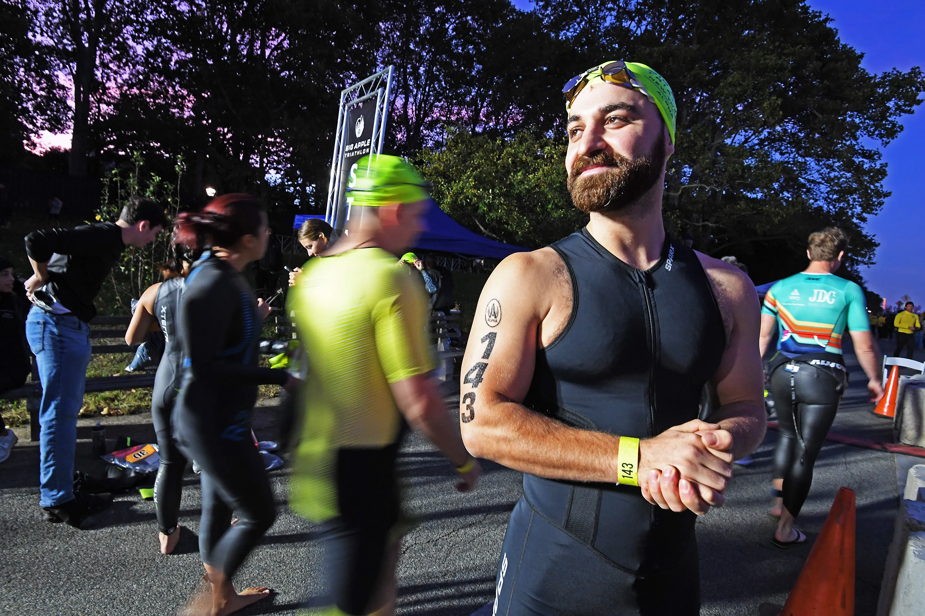 Jules Henderson of Brooklyn participates at the start of the swim in the Hudson River for the NYC Triathlon.