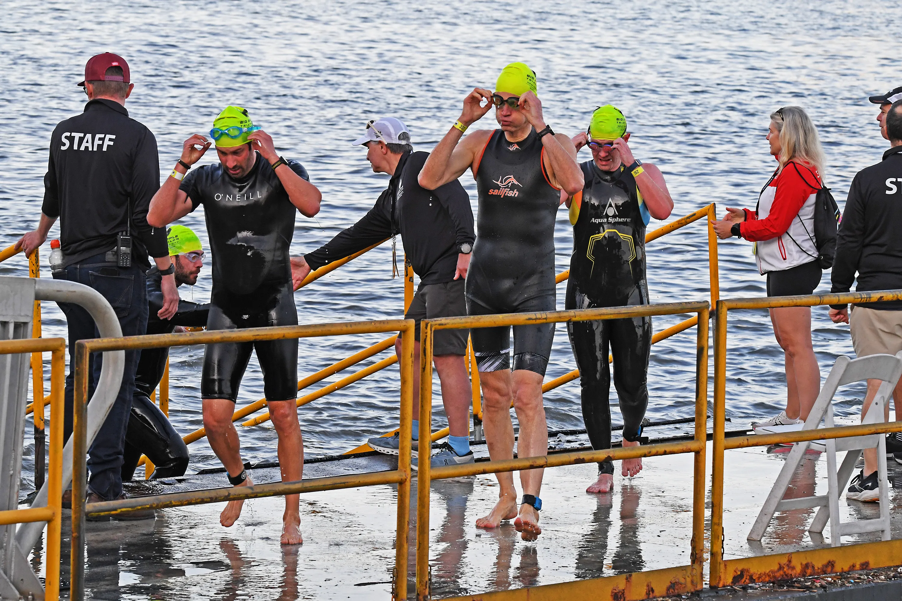 Triathletes exit the water after the swim portion of the NYC Triathlon.