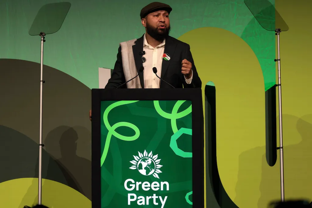 A man speaking at a lectern at the Green Party Conference.