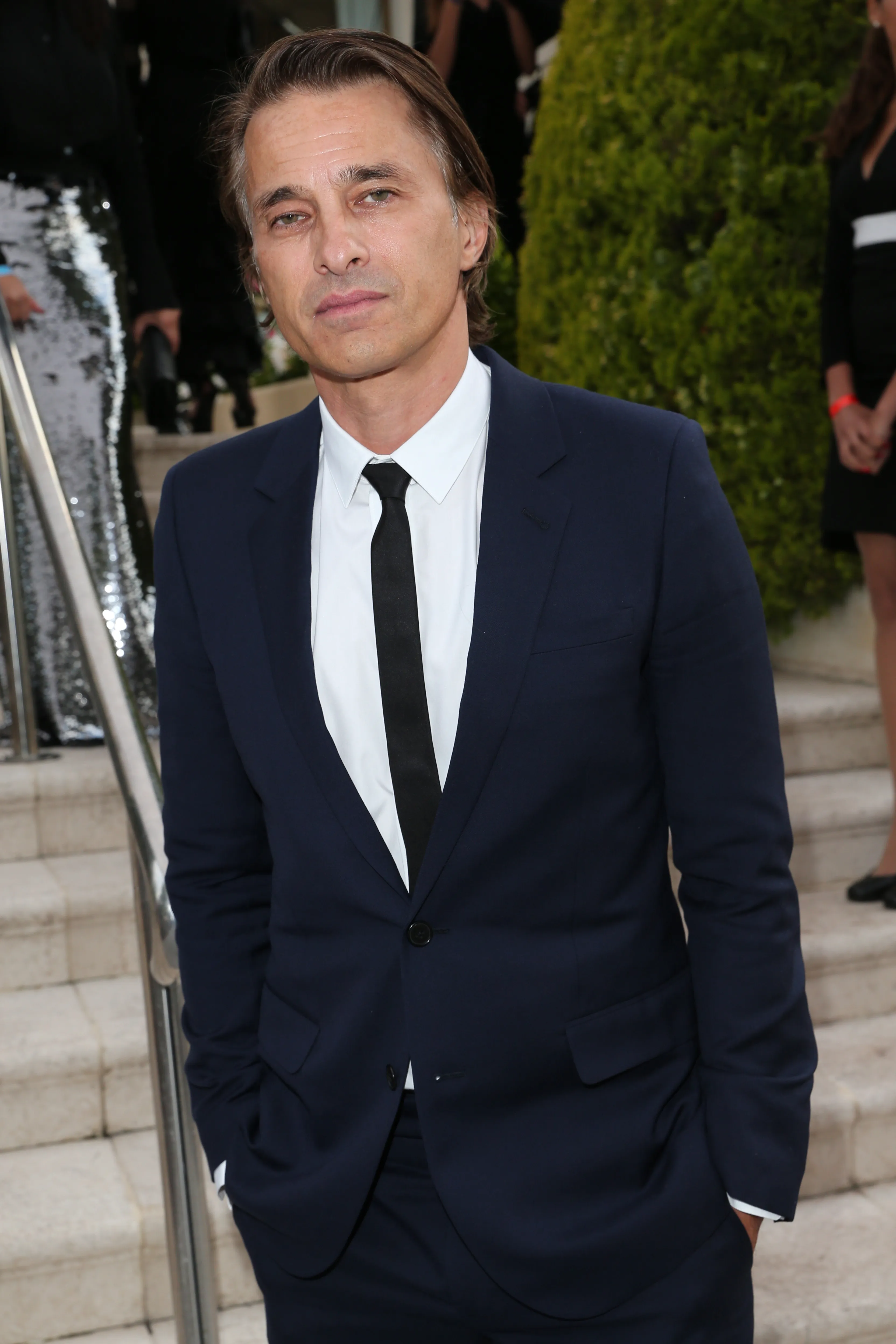 Olivier Martinez in a navy suit and black tie at the amfAR Gala Cannes.