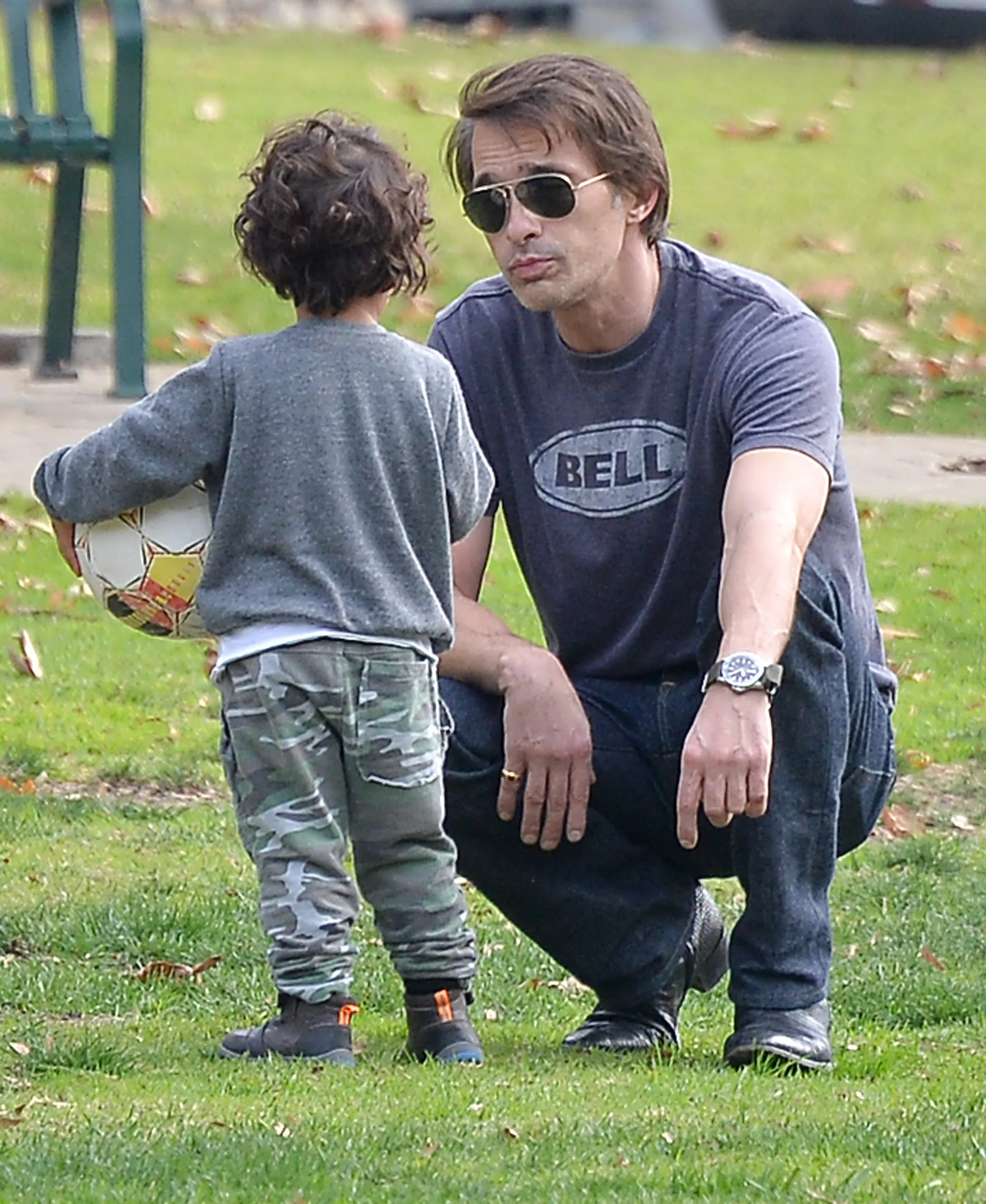 Olivier Martinez and his son Maceo Martinez in a park.