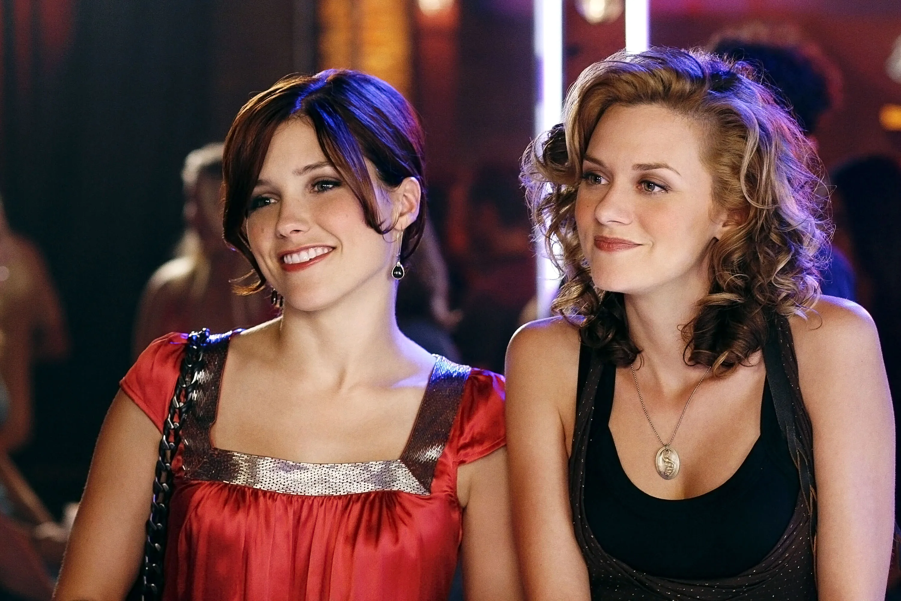 Sophia Bush and Hilarie Burton in a scene from One Tree Hill.