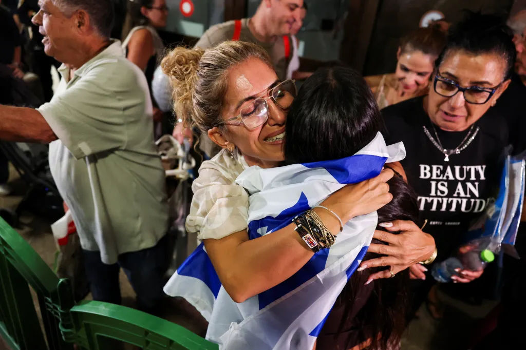 Passengers and their families reunite at Ben Gurion International Airport after a diverted FlyDubai flight.