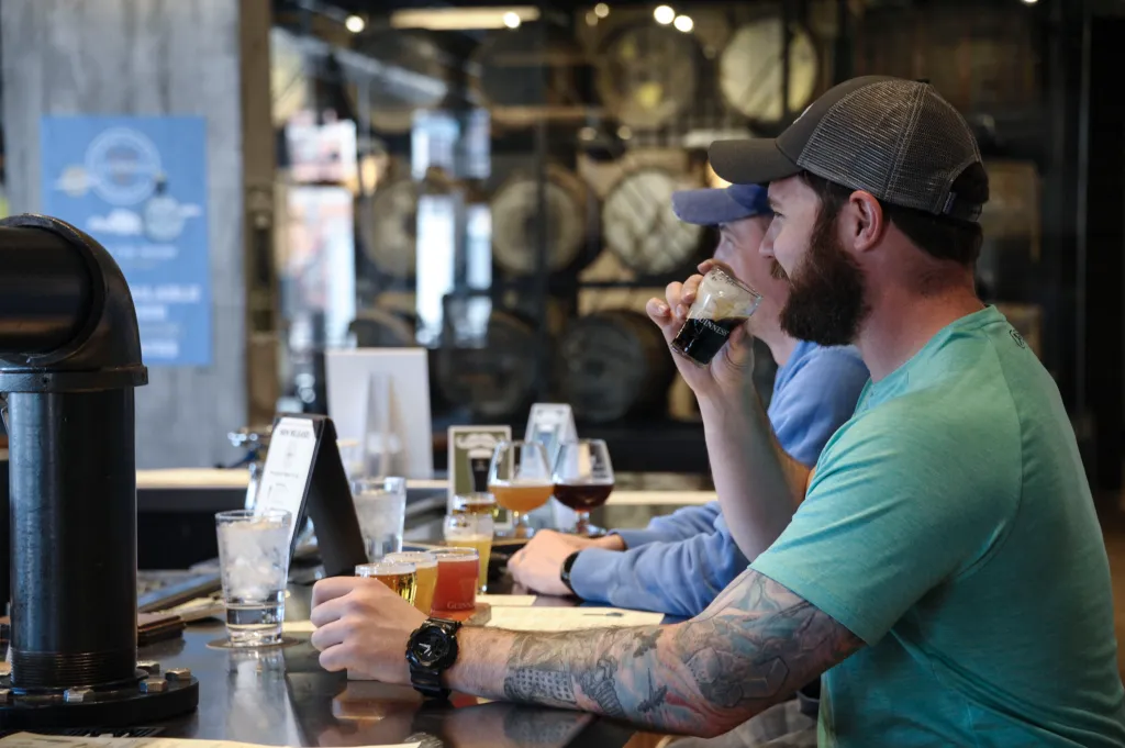 Patrons enjoy a beer testing session at the Guinness Open Gate Brewery in Baltimore.