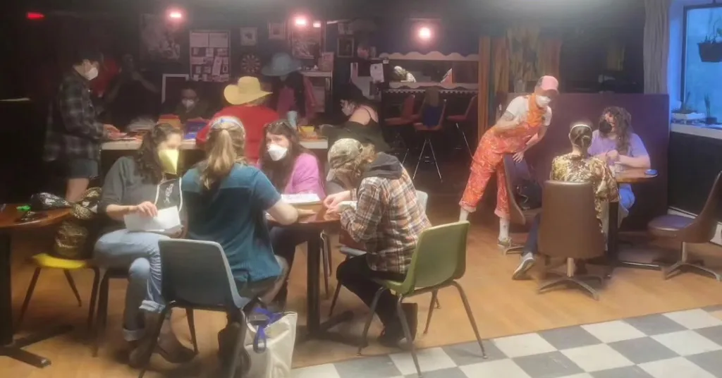 People wearing masks at Last Ditch Bar and Arts Venue.