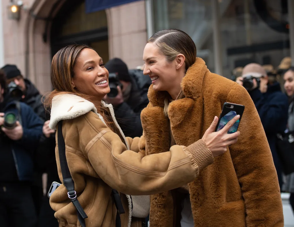 Candice Swanepoel and Joan Smalls take a selfie together.