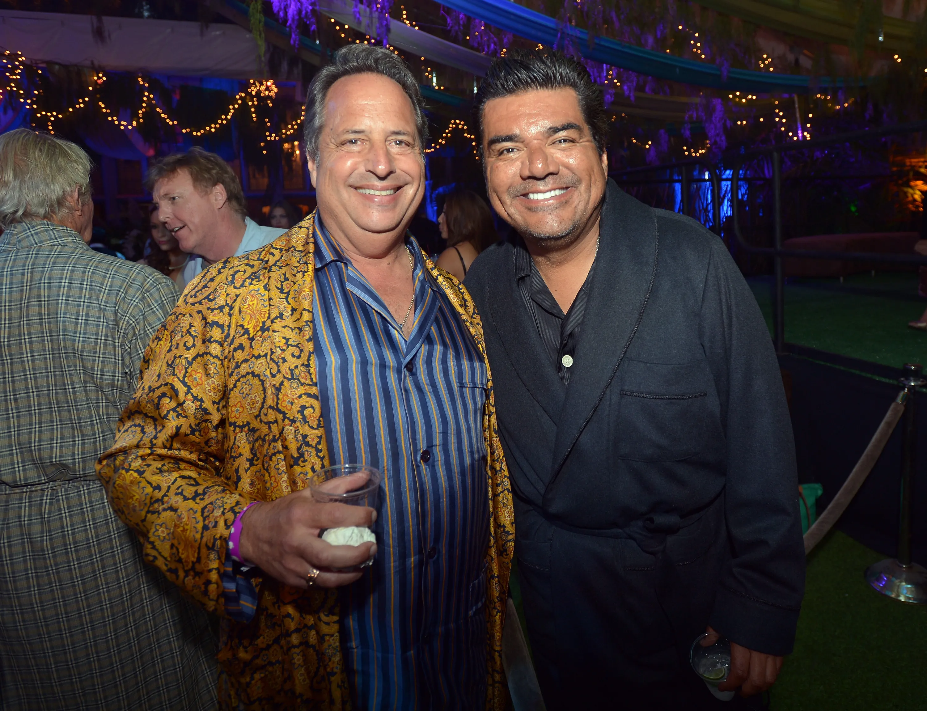 Actors Jon Lovitz and George Lopez attending a party.