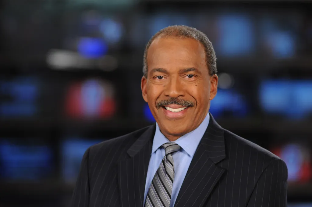 WCVB's Jim Boyd posing in a suit and tie.
