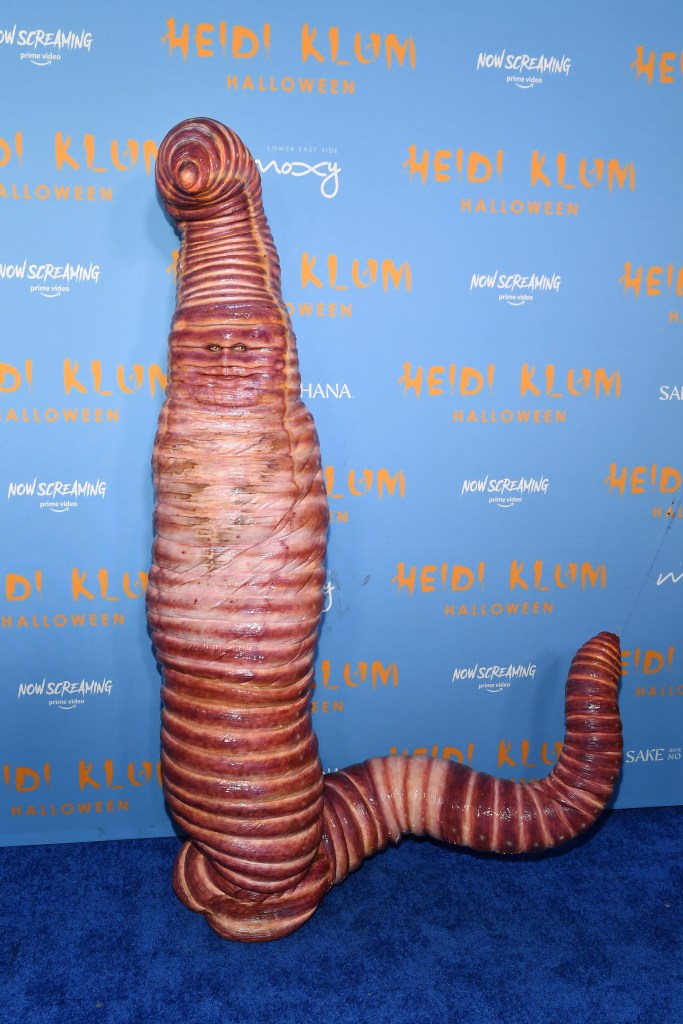 Heidi Klum in a giant earthworm costume at her annual Halloween party.
