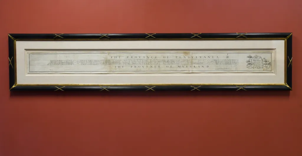 The original, hand-drawn survey of the Mason-Dixon Line in a black and gold frame.
