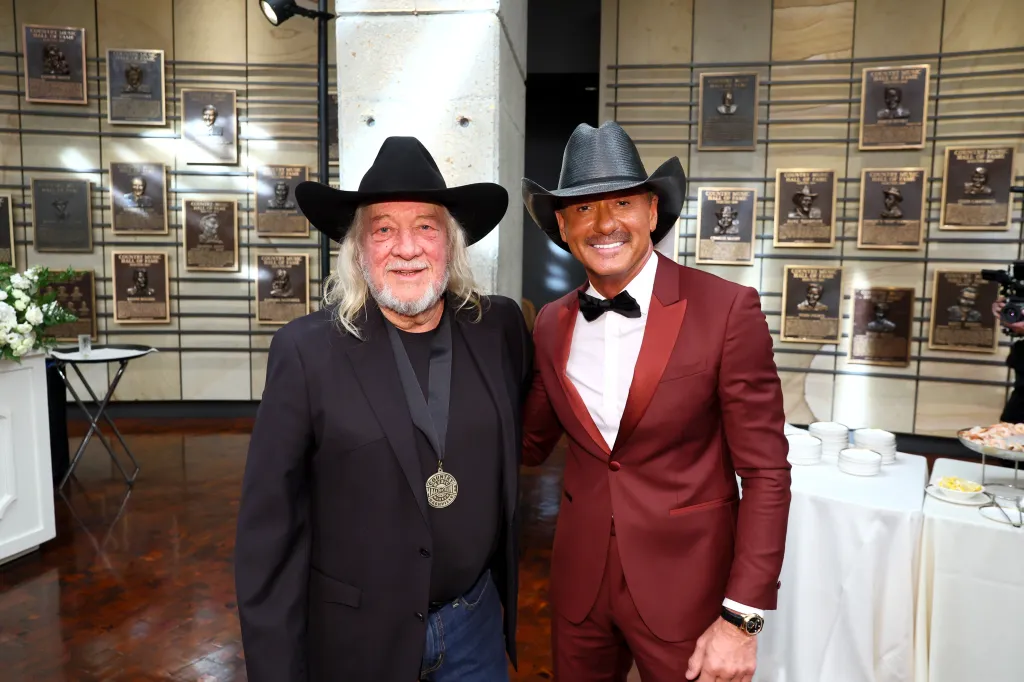 John Anderson and Tim McGraw pose together at the Country Music Hall of Fame and Museum.