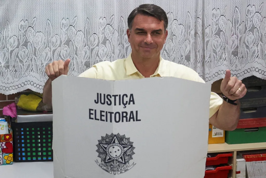 Brazil's presidential candidate Flavio Bolsonaro gestures as he votes during the general election in Rio de Janeiro.