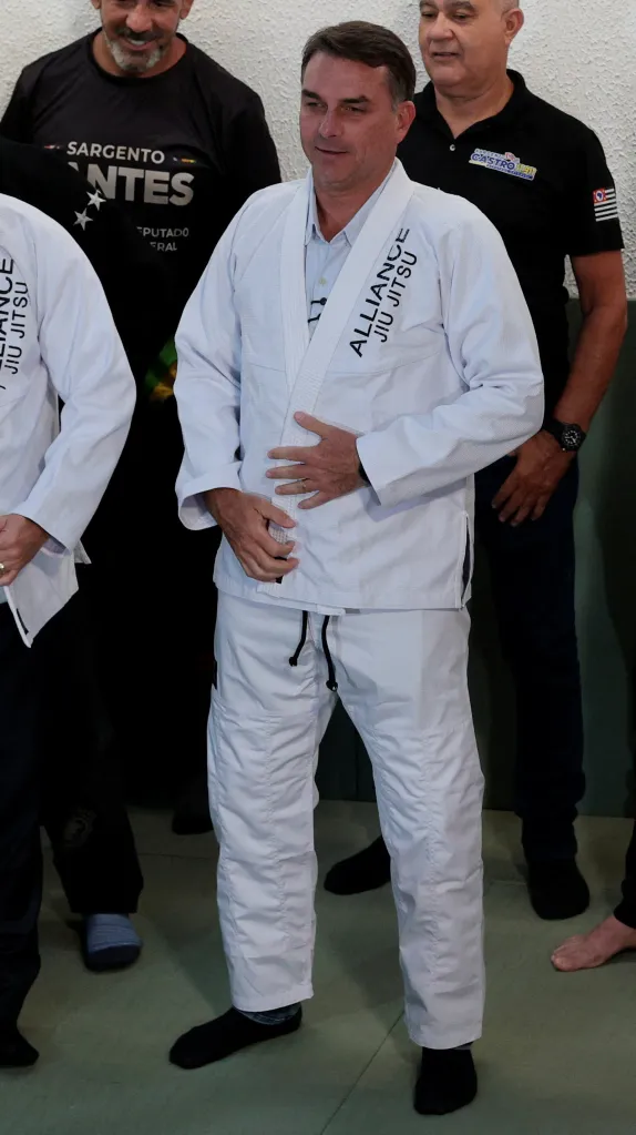Brazilian presidential candidate Flavio Bolsonaro poses in a Jiu Jitsu uniform in Sao Paulo.