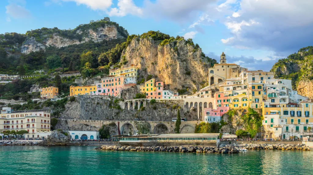 Colorful buildings of Amalfi village built into the cliffs along the Amalfi Coast, Italy.