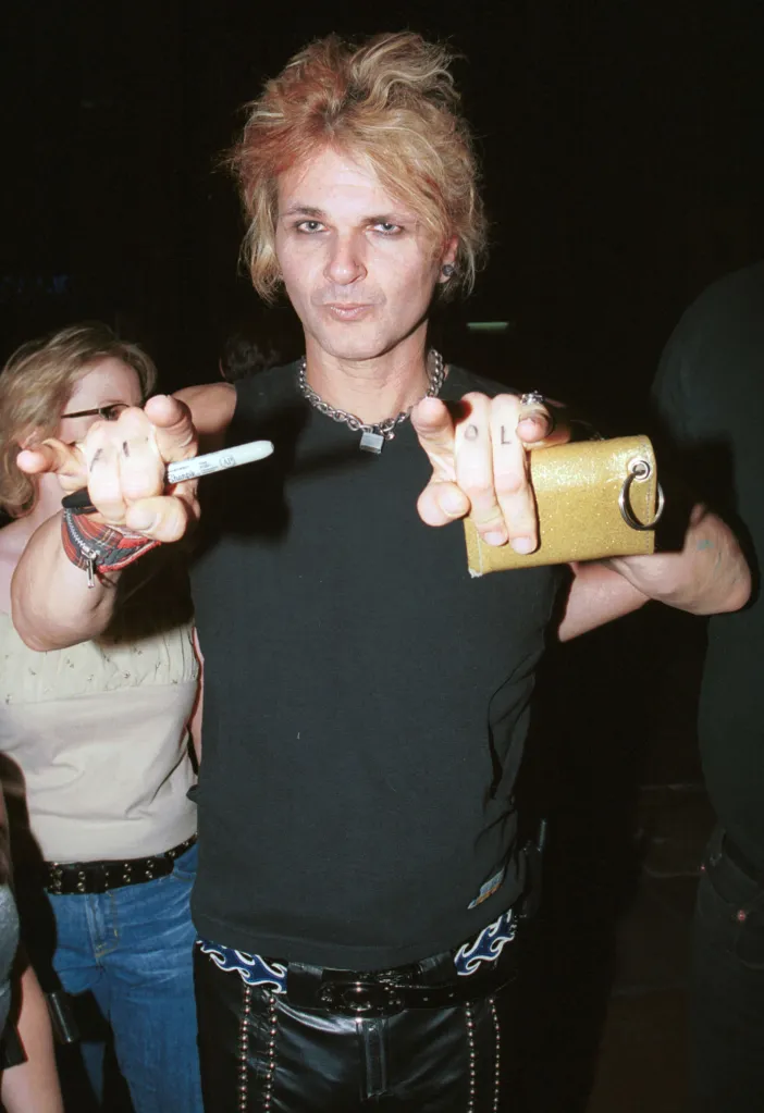 Poison's drummer Rikki Rockett poses outside of the Roxy in West Hollywood, Calif.