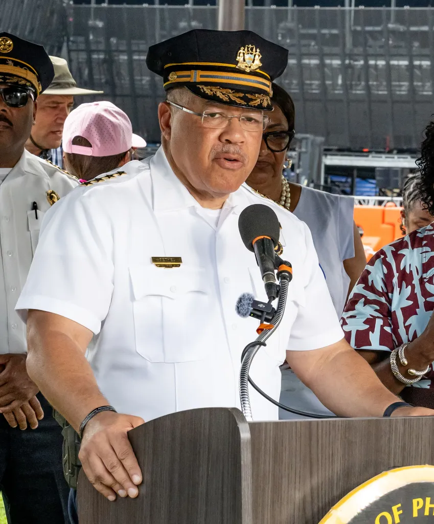 Police Commissioner Kevin J. Bethel speaks at a podium during a press conference.