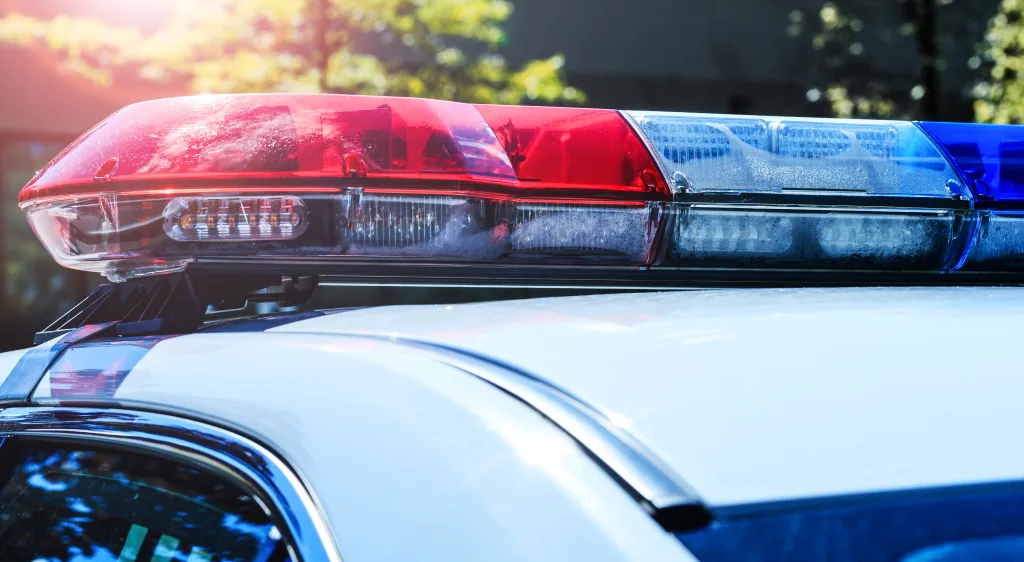 Red and blue light bar on the roof of a Canadian police patrol car.